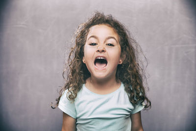 Portrait of boy against white background