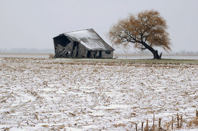 Built structure on snow covered field