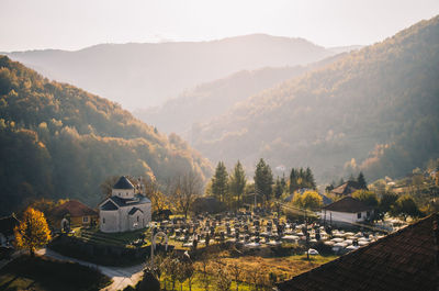 Panoramic shot of buildings and mountains against sky