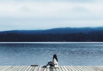 View of birds on lake against sky