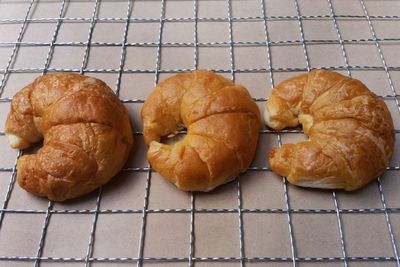 Close-up of croissants on cooling rack