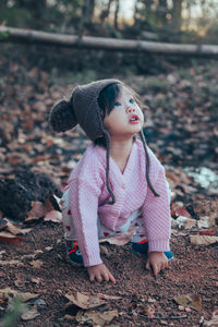 Cute girl wearing hat on land