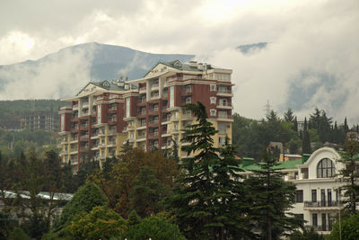 Buildings in city against sky