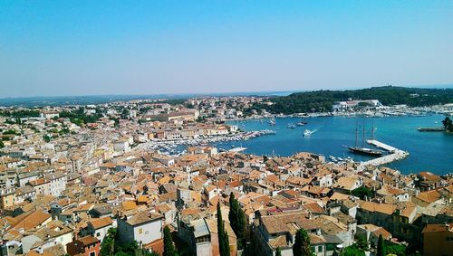 View of cityscape against blue sky