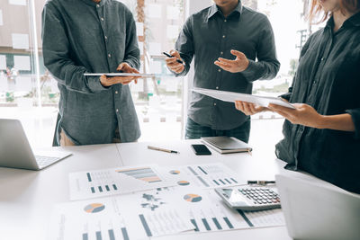 Group of people working on table