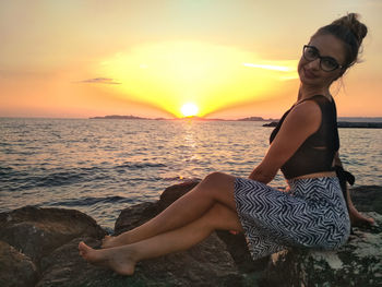 Woman on beach during sunset