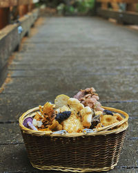 High angle view of mushrooms in basket on table