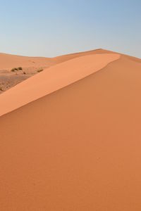 Scenic view of desert against clear sky