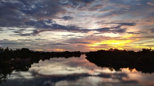 Scenic view of lake against sky during sunset