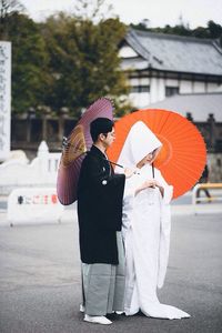 Full length of woman standing in city