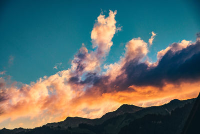 Low angle view of dramatic sky during sunset