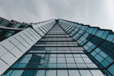 Low angle view of skyscraper against sky