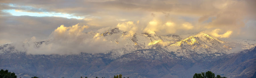 Scenic view of snowcapped mountains against sky