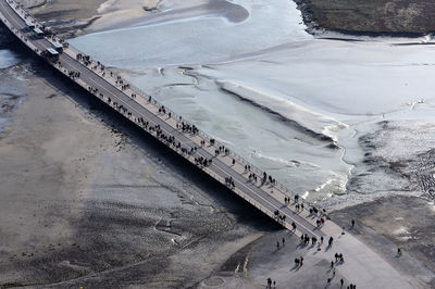 View from the mont saint michel, france bridge, sea and sand, aerial view of the tide