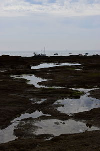 Scenic view of beach against sky