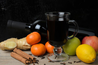 Fruits in glass on table