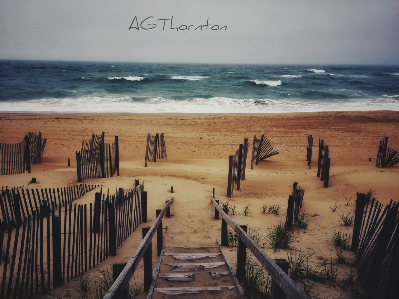 sea, horizon, horizon over water, water, beach, land, sky, scenics - nature, beauty in nature, wood - material, tranquil scene, sand, tranquility, nature, text, no people, day, idyllic, railing, wooden post