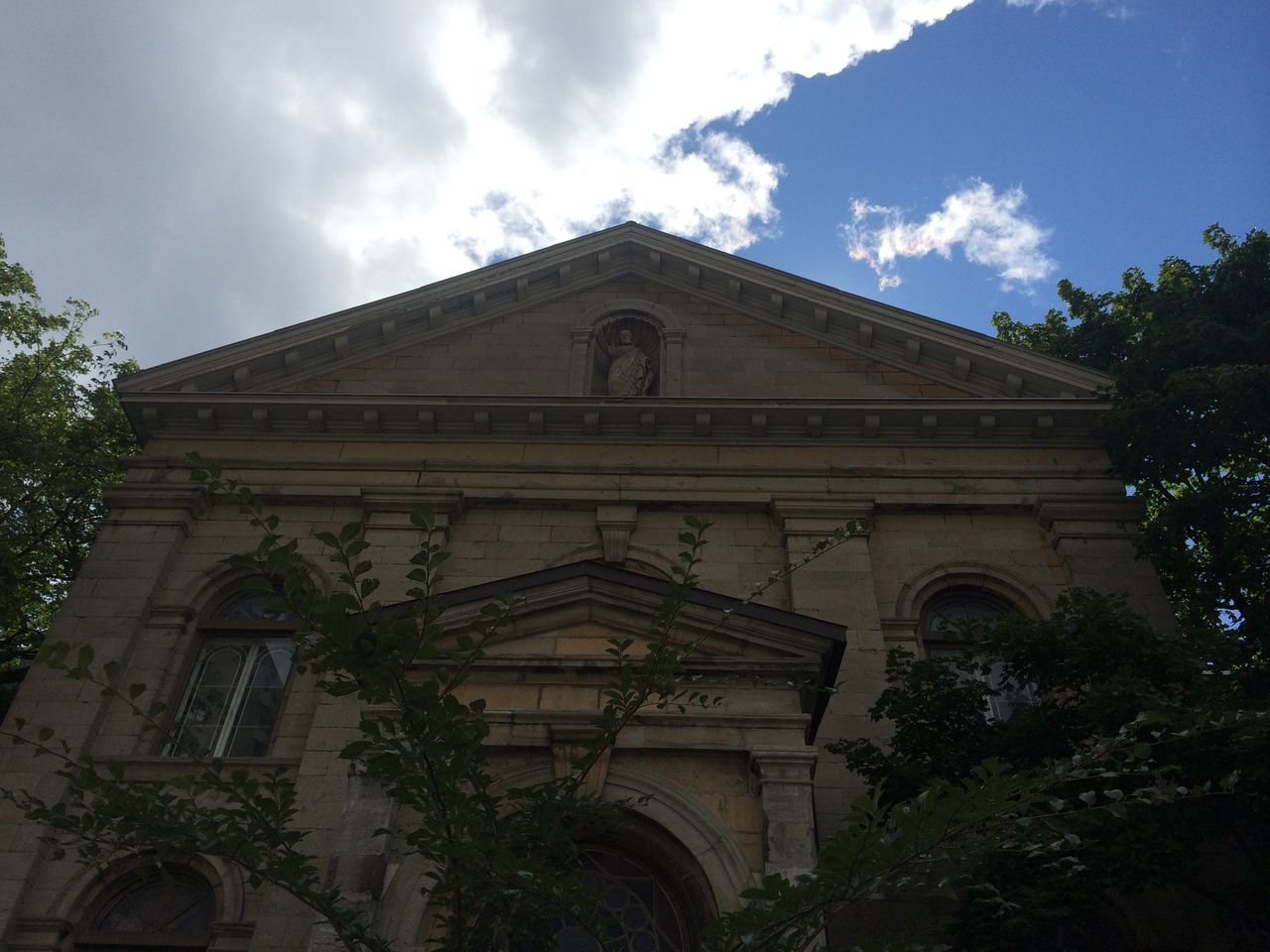 architecture, built structure, building exterior, low angle view, sky, religion, place of worship, spirituality, church, tree, cloud - sky, facade, history, arch, cloud, cathedral, no people, day