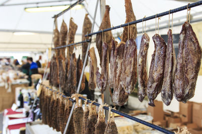 Salami hanging at market for sale