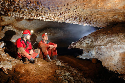 Workers sitting in cave