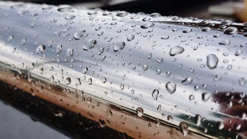 Close up of raindrops on metal