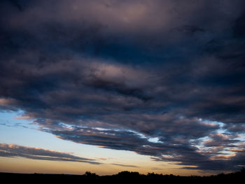 Low angle view of dramatic sky during sunset