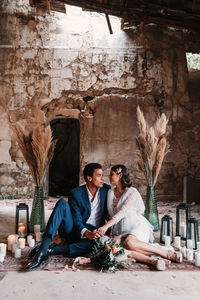 Young couple sitting outdoors