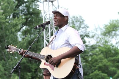 Full length of man playing guitar