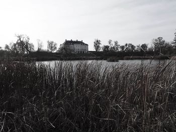 Abandoned house on field against sky