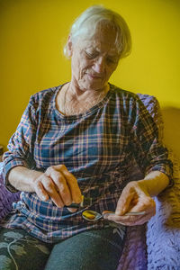 Portrait of senior man using mobile phone