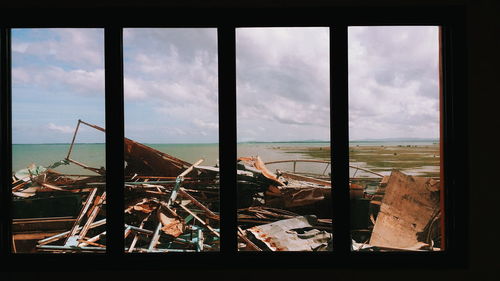 View of sea seen through window