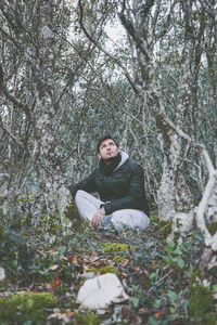 Portrait of young man in forest