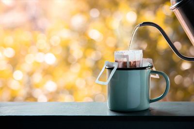 Close-up of coffee cup on table