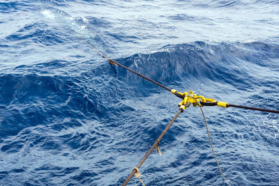 High angle view of sailboat sailing in sea