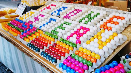 High angle view of text made of easter eggs at market stall