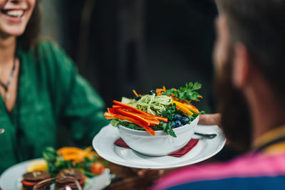 Food amidst couple dating in restaurant