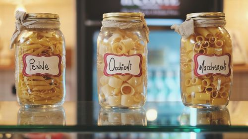 Close-up of pastas in jars at shop