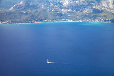 Aerial view of small boat flowing in sea, travel and vacation concept