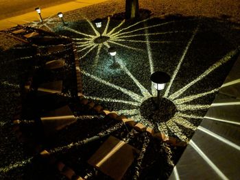 Low angle view of illuminated lights hanging from ceiling