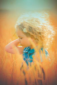 Close-up of girl standing in farm