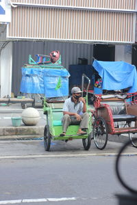 Man riding motorcycle on road