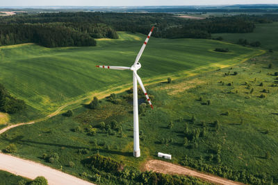 Windmills on the background of forests and fields. windmill in nature.belarus