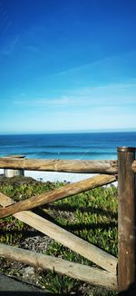 Scenic view of sea against blue sky