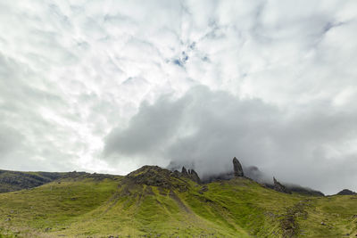 Scenic view of green landscape against sky