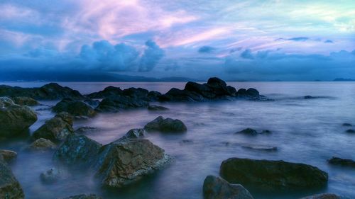 Scenic view of sea against cloudy sky