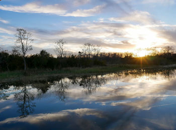 Scenic view of lake against sky during sunset