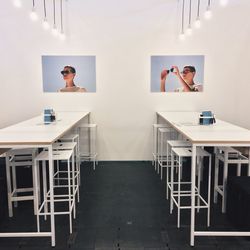 Full length of young woman sitting on table
