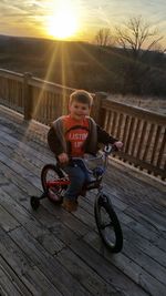 Man riding bicycle on railing