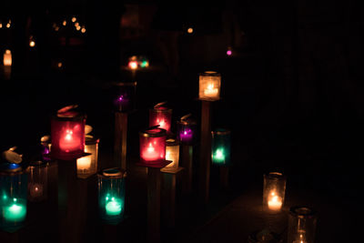Close-up of illuminated tea light candles