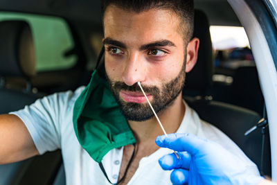 Portrait of man in car